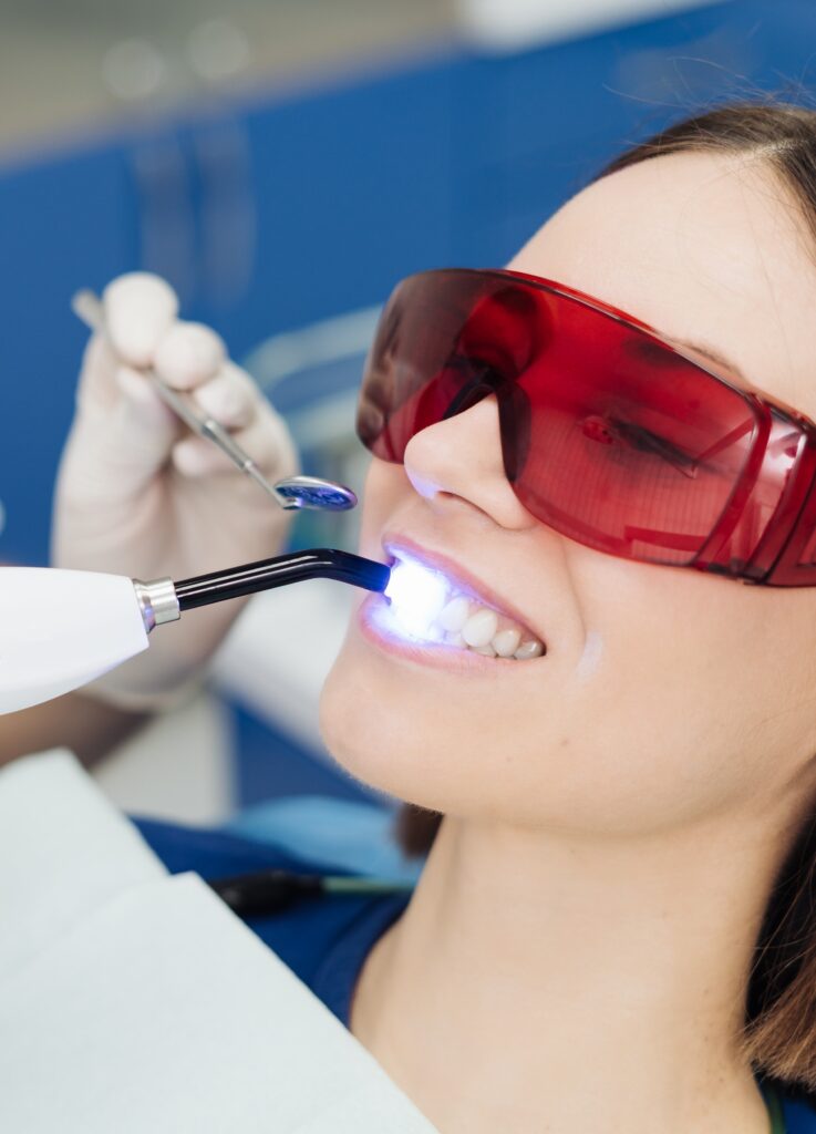 Young woman getting dental treatment.
